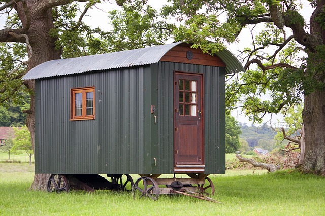 shepherd hut in field